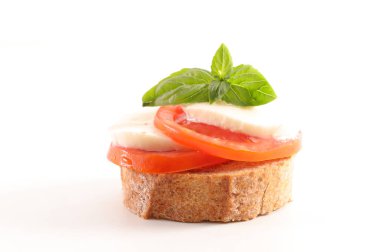 Domates, mozzarella ve fesleğenli bruschetta.