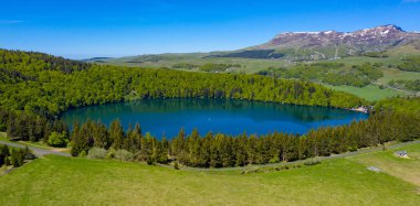 lac pavin and forest- lake pavin auvergne in france clipart