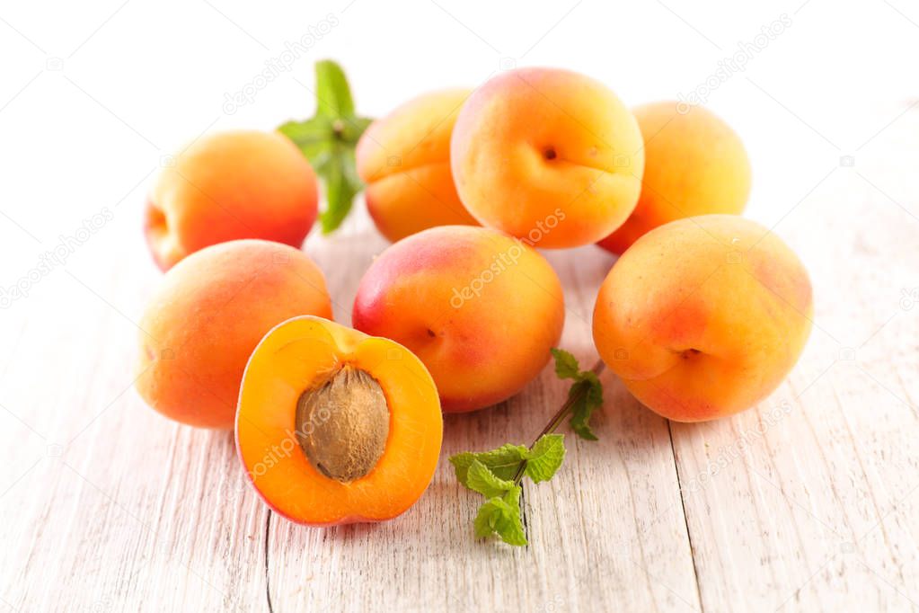 group of juicy apricot and leaf
