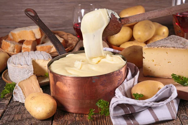 aligot, french gastronomy with cheese, potato and sausage