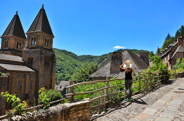 famous touristic french village with woman looking at the view