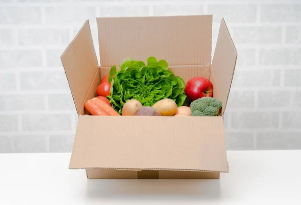 Vegetables box, delivery box. Fresh fruits and vegetables .