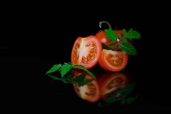Fresh tomato on black background — Stock Photo, Image