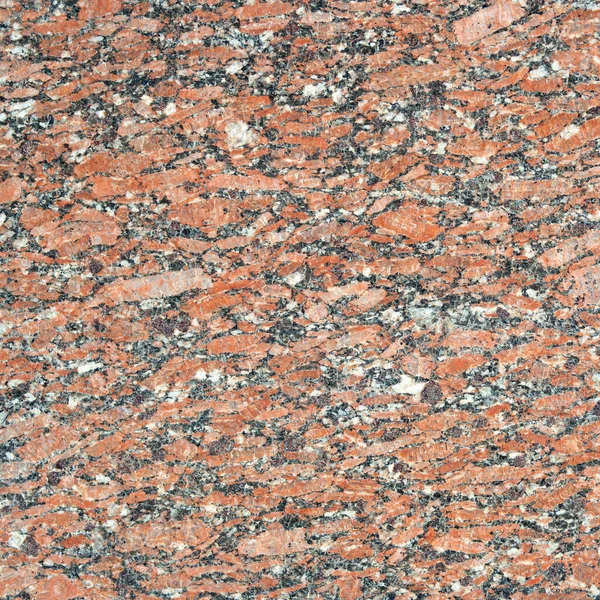 Polished granite texture, closeup. red-gray-brown bacrground