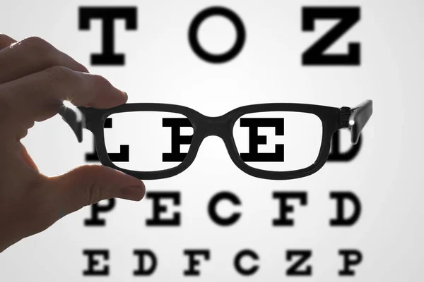 Hands Holding Glasses Front Vision Test Blurry Sharp Areas — Stock Photo, Image