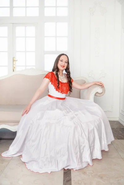 Beautiful Woman White Red Medieval Dress Sitting Sofa — Stock Photo, Image