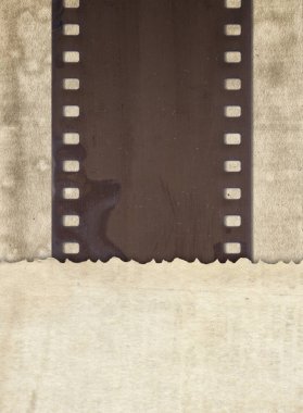 Yaşlı retro kağıt ve eski film şeridi ile antika arka plan