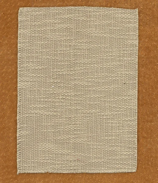 Fabric linen textile on the leather texture background