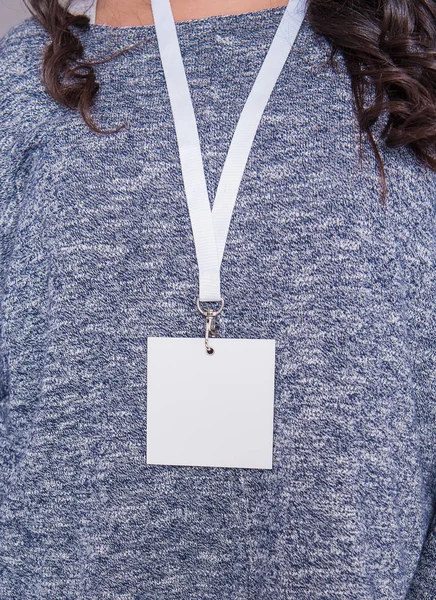 Woman with blank tag id name card. Mockup for design
