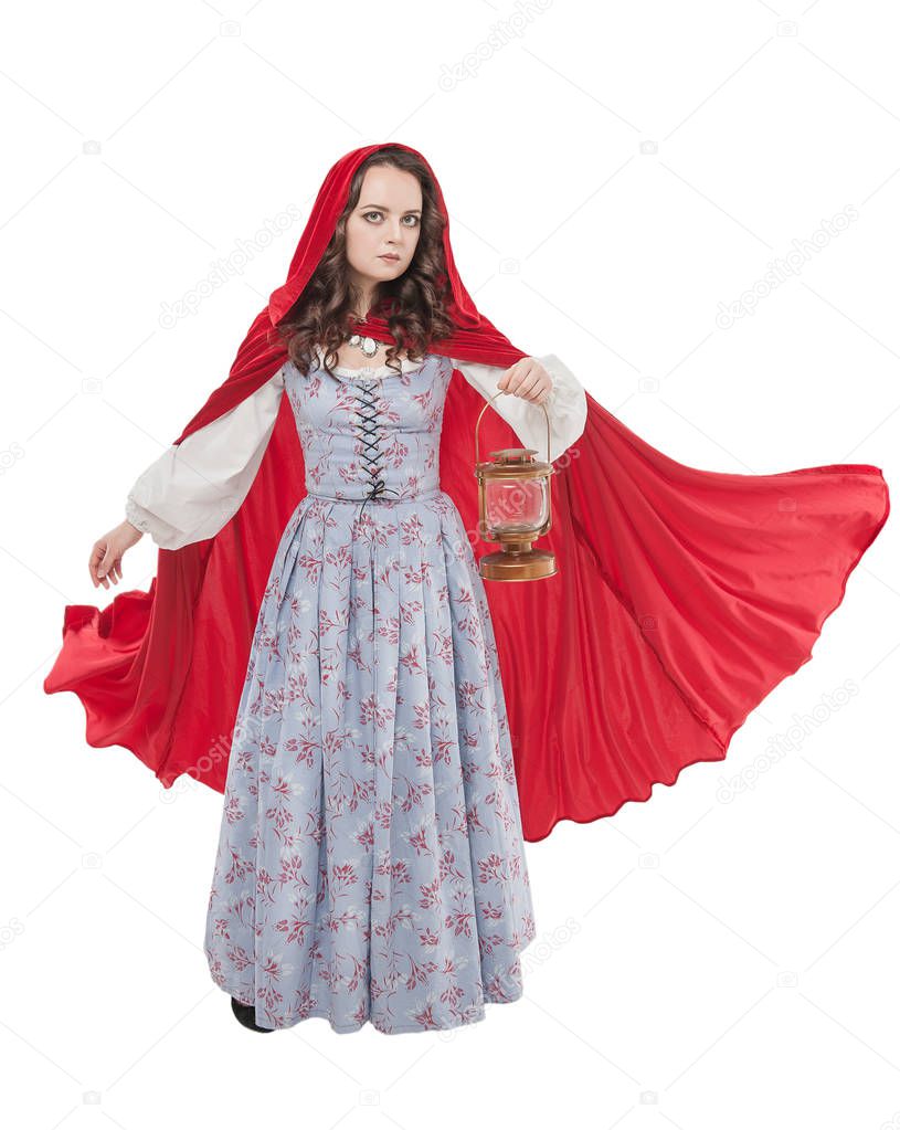 Beautiful woman in old historic medieval dress with lantern