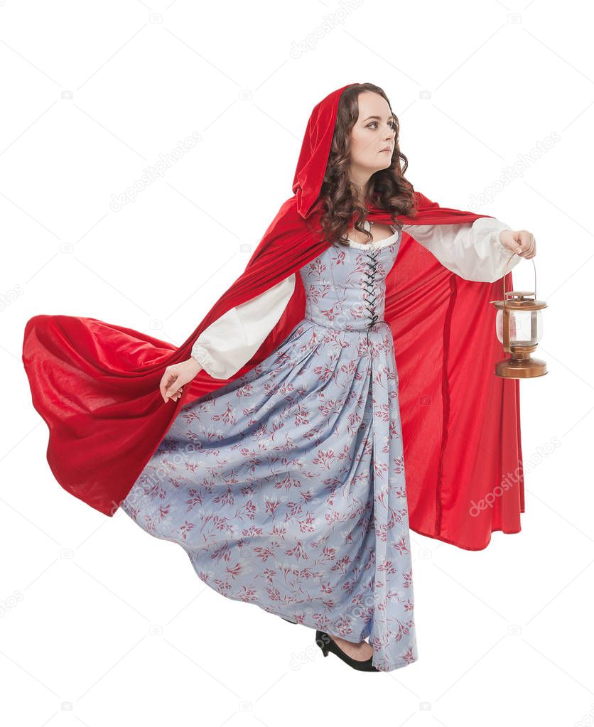 Beautiful woman in old historic medieval dress with lantern 