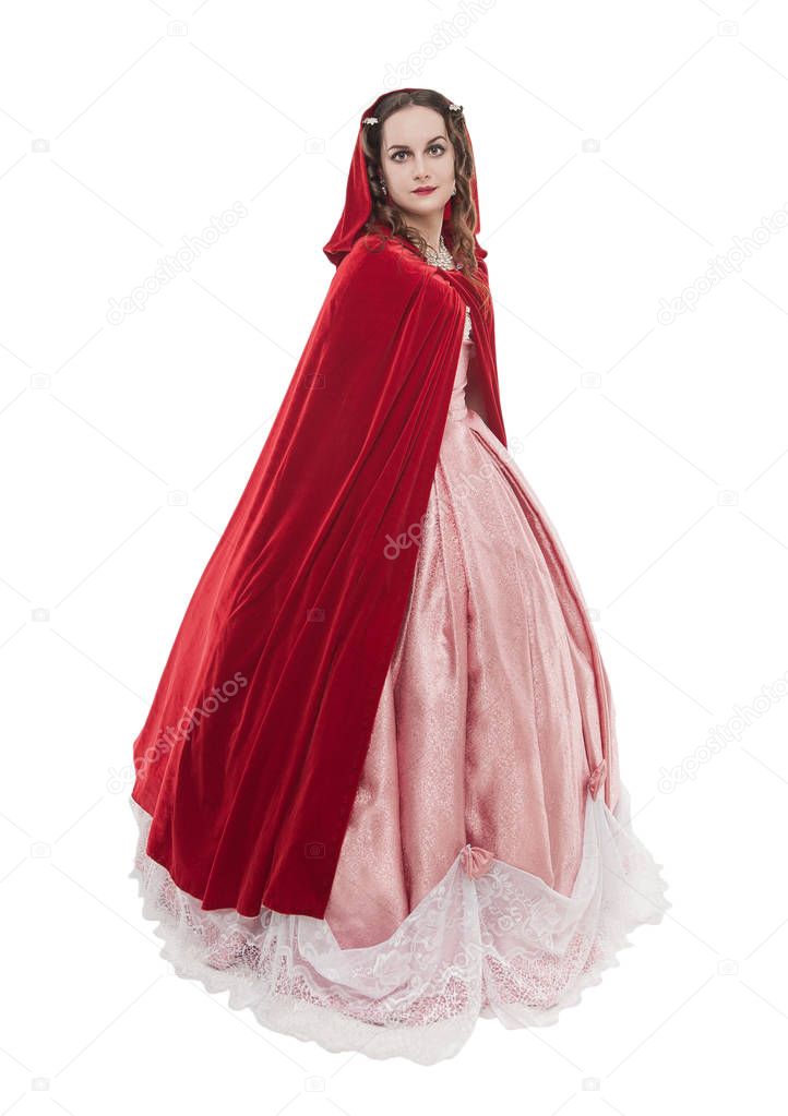 Young beautiful woman in long medieval dress and red cloak isola