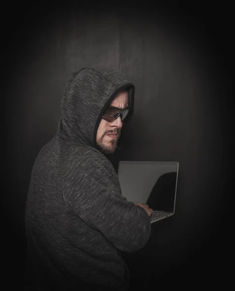 Man hacker programmer using laptop on dark — Stock Photo, Image