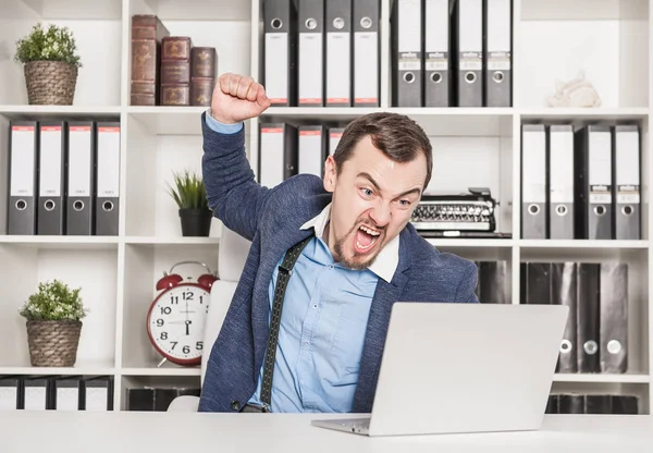 Angry business man breaking laptop. Stress concept — Stock Photo, Image