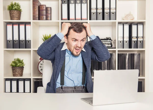 Upset business man working in office — Stock Photo, Image