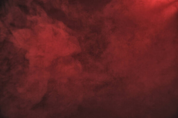 Red dense smoke on the dark background