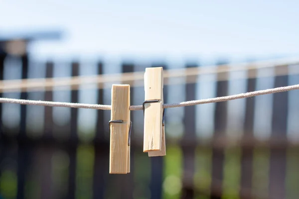 Wooden Clothespins Clothesline Background Wooden Fence — Stock Photo, Image