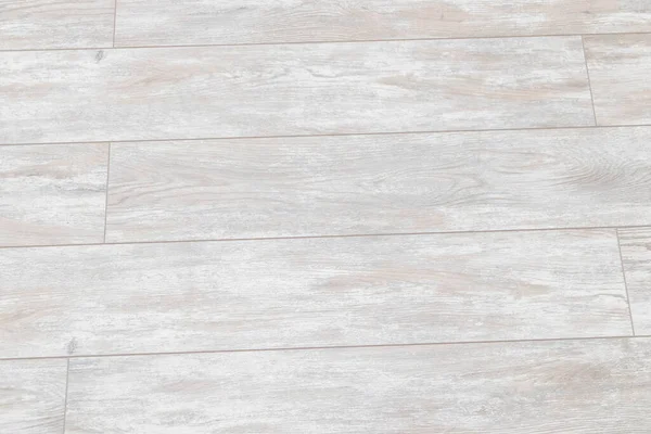 Beyaz ahşap zemin kaplaması. Yeni plastik kaplama döşeme fayansı. Üst görünüm.