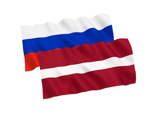 Flaggor av Ryssland och Lettland på vit bakgrund — Stockfoto