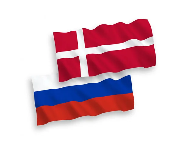 Drapeaux du Danemark et de la Russie sur fond blanc — Image vectorielle