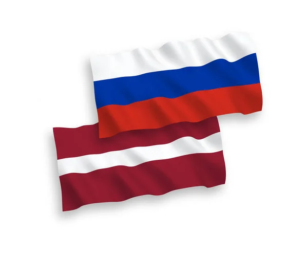 Flaggor av Lettland och Ryssland på en vit bakgrund — Stock vektor