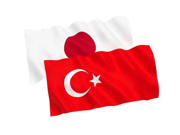 Bandeiras da Turquia e do Japão sobre um fundo branco — Fotografia de Stock