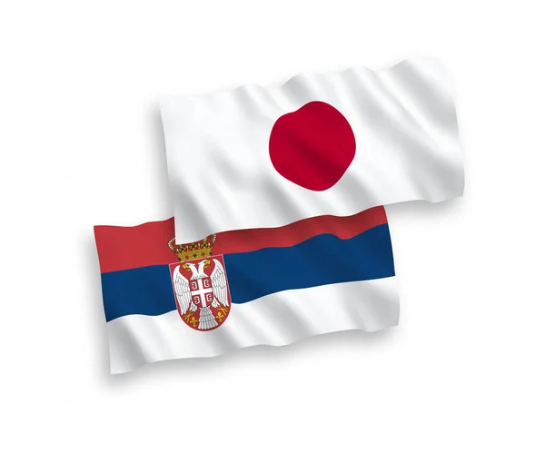 하얀 배경에 있는 일본 과 세르비아의 깃발 — 스톡 벡터