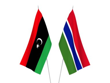 Beyaz arka planda Libya ve Gambiya Cumhuriyeti 'nin ulusal kumaş bayrakları izole edildi. 3d resimleme.