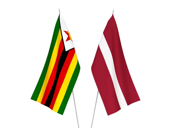 Flagi Łotwy i Zimbabwe — Zdjęcie stockowe