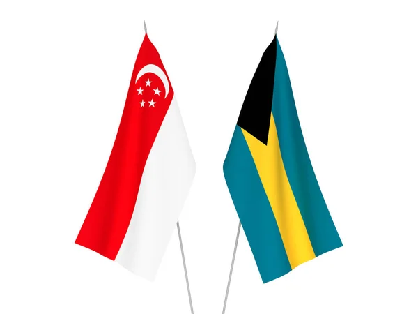 Nationell Tyg Flaggor Samväldet Bahamas Och Singapore Isolerade Vit Bakgrund — Stockfoto