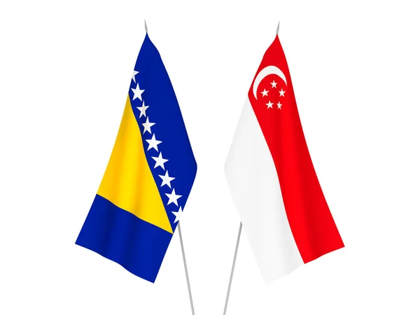 National fabric flags of Bosnia and Herzegovina and Singapore isolated on white background. 3d rendering illustration.