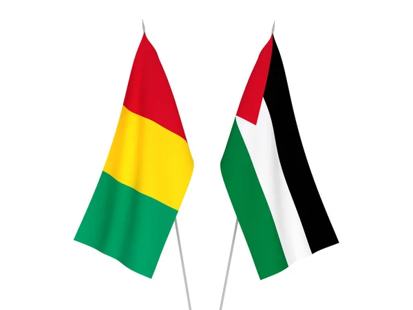 National fabric flags of Palestine and Guinea isolated on white background. 3d rendering illustration.