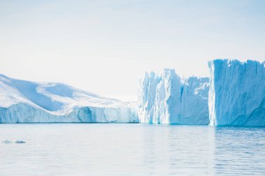 Big blue icebergs in the Ilulissat icefjord, Greenland clipart