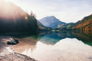 Lake in the nountains at sunset. Vorderer Langbathsee lake in autumn Alps mountains, Austria.