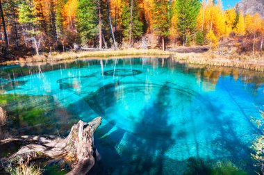 Geyser lake in autumn Altai mountains, Siberia, Russia clipart