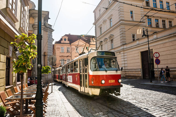 Retro tram driving on the street in Old Town of Prague