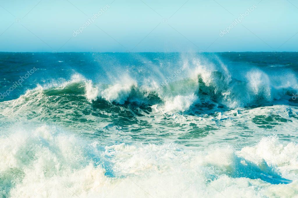Waves on the coast of Atlantic ocean in Nazare, Portugal. Beautiful nature background.