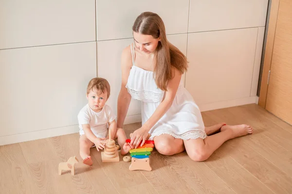 Cute Little Baby Boy Playing His Mother Wooden Stacking Rings — Stock Photo, Image