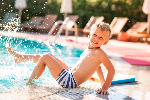 Happy little boy having fun at the pool — Stock Photo, Image