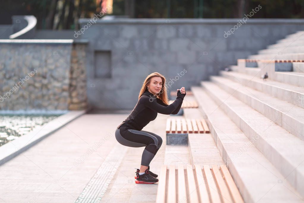 Fitness woman jumping outdoor in urban environment