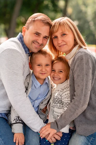 Happy family having fun together in the park outdoor — Stock Photo, Image