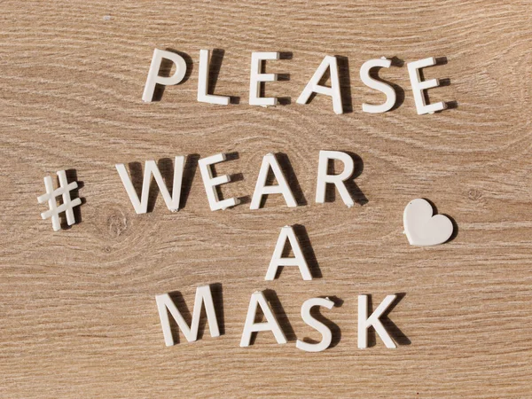 hashtag wear a mask. preventive health care notice sign with text PLEASE WEAR A MASK at entrance for coronavirus prevention. measure in store businesses for face protection wearing.