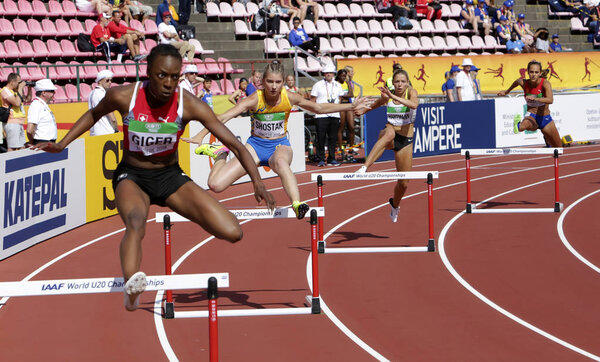 TAMPERE, FINLAND, July 11: YASMIN GIGER (SUI), MARYANA SHOSTAK (UKR), LISA SOPHIE HARTMANN (GER), SOLVEIG VRALE (NOR) 400 metrs hurdles heats on the IAAF World U20 Championship in Tampere, Finland 11 July, 2018.