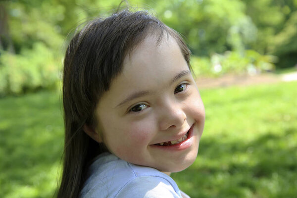 Portrait of little girl smiling in the park