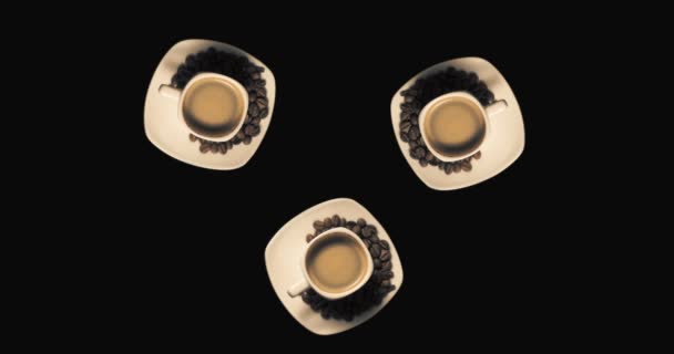 Drie kopjes met roterende koffie — Stockvideo