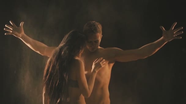 Beautiful couple in flour particles — Stock Video
