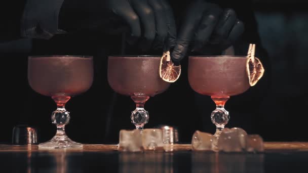 Barman make a cocktails on a bar