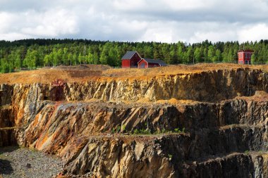 Mining Area of the Great Copper Mountain in Falun, Sweden - UNESCO World Heritage Site. The are an outstanding example of a technological ensemble with a historical industrial landscape. clipart