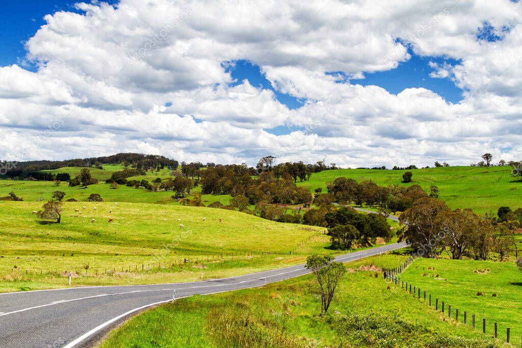 Winding road through farmlands in Queensland, Australia.