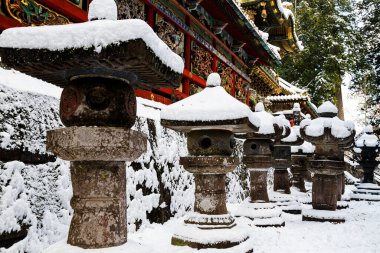 Nikko, Japan - UNESCO World Heritage Site. Part of Tosho-gu Shinto shrine, traditional stone lanterns. clipart